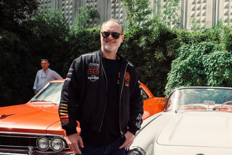 Maximillion Cooper in Istanbul with Gumball 3000 hypercars at the Cars on Sundays event, joined by Ferrari, Mercedes, and Lamborghini supercars.